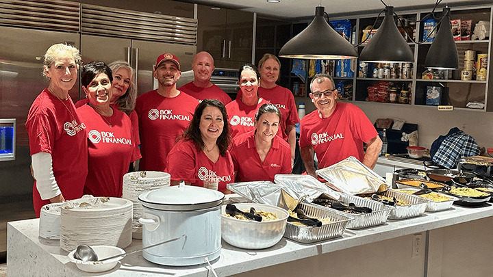 BOK Financial volunteers serving hot food for Ronald McDonald House.