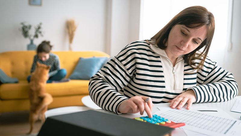 Woman at home practicing strategies for building financial confidence.
